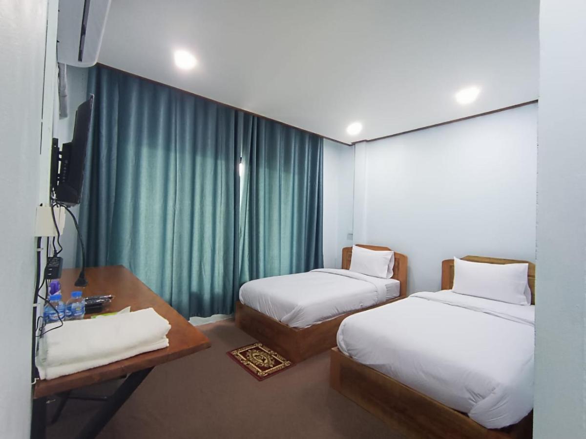 Отель ເຮືອນພັກບີວີ Ban Thongchai-Tai Экстерьер фото